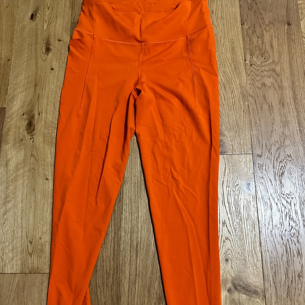Calia orange leggings side pockets and back zipper pocket size L